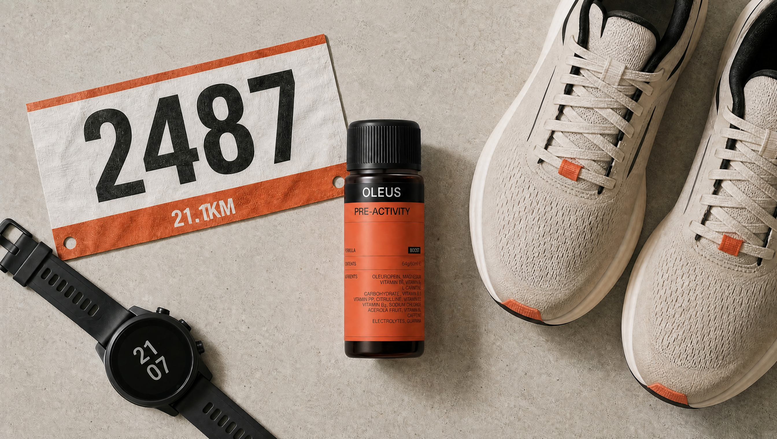 Marathon-day essentials, including the OLEUS Pre-Activity Shot laid outlaid out